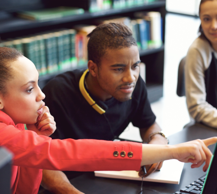 group-of-students-doing-online-research-in-library-PSTLNGR(1)