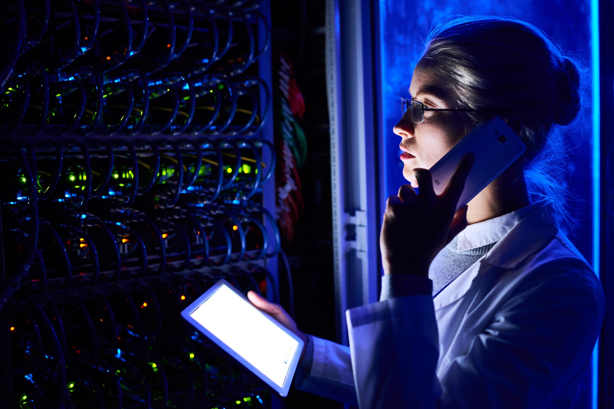 Female Scientist in Futuristic Data Laboratory